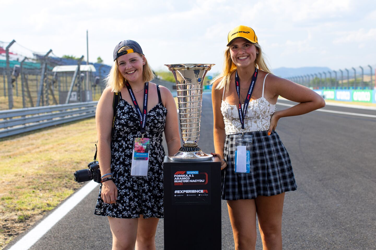 Two f1 fans with Trophy